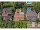 Aerial view of the property showing roof, neighboring homes, in-ground pool, and mature landscaping at 1740 Shady Leaf Dr, Valrico, FL 33596