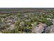 High aerial showcases a residential area dotted with trees, near community facilities and open spaces at 1740 Shady Leaf Dr, Valrico, FL 33596