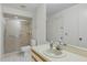 Full bathroom featuring a shower with glass doors, a toilet, and a single sink at 1740 Shady Leaf Dr, Valrico, FL 33596