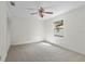 Cozy bedroom with neutral carpet, a window, and a ceiling fan at 1740 Shady Leaf Dr, Valrico, FL 33596