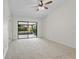 Bright bedroom with a sliding glass door providing outdoor views and natural light at 1740 Shady Leaf Dr, Valrico, FL 33596