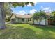 A cozy home with stone features, beautiful shrubs, and a well-kept lawn at 1740 Shady Leaf Dr, Valrico, FL 33596