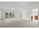 Light and airy living area with tile entry and large windows at 1740 Shady Leaf Dr, Valrico, FL 33596