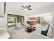 Open-concept living area with kitchen, dining area, and sliding glass door to lanai at 1740 Shady Leaf Dr, Valrico, FL 33596