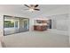 Open living space flows to kitchen, featuring sliding glass doors to a screened in patio at 1740 Shady Leaf Dr, Valrico, FL 33596