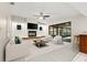 Bright living room with fireplace, ceiling fan and sliding glass doors to the lanai at 1740 Shady Leaf Dr, Valrico, FL 33596