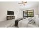 Spacious main bedroom featuring a sliding glass door leading to the screened-in lanai at 1740 Shady Leaf Dr, Valrico, FL 33596