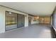Large, covered screened-in porch with multiple access points to the home's interior at 1740 Shady Leaf Dr, Valrico, FL 33596