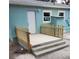 Back porch with freshly painted blue siding and new railings at 2432 Auburn S St, St Petersburg, FL 33712