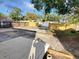 Large backyard features a concrete patio and a newer fence at 2432 Auburn S St, St Petersburg, FL 33712
