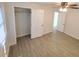 Spacious bedroom featuring a closet, wood-look flooring, and a ceiling fan at 2432 Auburn S St, St Petersburg, FL 33712