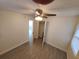 Spacious bedroom featuring a closet, wood-look flooring, and a ceiling fan at 2432 Auburn S St, St Petersburg, FL 33712