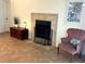 Living room features a decorative fireplace with stylish tile surround and classic furniture at 2580 Redwood Way, Clearwater, FL 33761