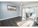 Bright dining room with hardwood floors, modern lighting, and sliding doors to the lanai at 2834 56Th Avenue E Cir, Bradenton, FL 34203