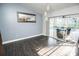 Open living area featuring sliding glass doors to the pool and wood-look tile flooring at 2834 56Th Avenue E Cir, Bradenton, FL 34203