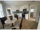Modern kitchen with stainless steel appliances, white cabinets and tiled backsplash at 38638 2Nd Ave, Zephyrhills, FL 33542