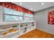 Bright Living Room with windows, wood floors, and shelving at 4830 14Th N Ave, St Petersburg, FL 33713