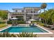 Luxurious pool and spa area, surrounded by lush landscaping, perfect for relaxation and entertainment at 5004 S The Riviera, Tampa, FL 33609