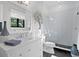 Bright bathroom featuring a glass shower, stylish decor, and a decorative mirror at 5004 S The Riviera, Tampa, FL 33609
