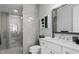 This bathroom offers a glass shower and a single sink vanity, perfect for a modern aesthetic at 5004 S The Riviera, Tampa, FL 33609