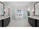 Spacious bathroom featuring dual vanities, a soaking tub, and walk-in showers at 5004 S The Riviera, Tampa, FL 33609