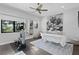 Spacious bedroom featuring an exercise machine, massage table, ceiling fan and plenty of natural light at 5004 S The Riviera, Tampa, FL 33609
