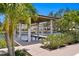 Beautiful backyard boat dock with lift, situated on the water, surrounded by lush tropical landscaping at 5004 S The Riviera, Tampa, FL 33609