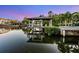 Waterfront property featuring a boat lift, enhancing the ease of access to boating and water activities at 5004 S The Riviera, Tampa, FL 33609