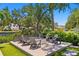 Cozy backyard area with a fire pit and comfortable seating for relaxing outdoors at 5004 S The Riviera, Tampa, FL 33609