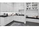 Charming kitchen area features sleek countertops, all white cabinetry, and a cozy window seat at 5004 S The Riviera, Tampa, FL 33609