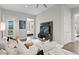 Comfortable living room with an open layout, modern entertainment center, and views to the bedroom at 5004 S The Riviera, Tampa, FL 33609