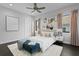 Beautiful bedroom featuring a large bed, stylish artwork, and hardwood floors at 5004 S The Riviera, Tampa, FL 33609