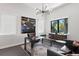 Stylish home office with a modern desk, leather seating, and large window with natural light at 5004 S The Riviera, Tampa, FL 33609