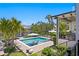 Beautiful backyard featuring a private pool, spa, waterfront access, and an outdoor entertaining area at 5004 S The Riviera, Tampa, FL 33609