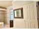 This bathroom offers a tub and shower combo, with a mirror and tile backsplash at 5125 Magnolia Pond Dr, Sarasota, FL 34233