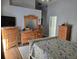 Bright bedroom with wood floors, light gray walls, and plenty of storage space at 6601 Thackston Dr, Riverview, FL 33578