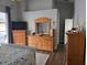This sunlit bedroom features wood floors, ample storage, and calming gray walls at 6601 Thackston Dr, Riverview, FL 33578