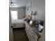 Cozy bedroom with natural light, neutral walls, and laminate flooring at 6601 Thackston Dr, Riverview, FL 33578