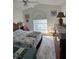 Inviting bedroom with vaulted ceiling, calming colors, and bright window with natural light at 6601 Thackston Dr, Riverview, FL 33578