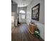 Inviting entryway with high ceilings, beautiful wood floors, and elegant wainscoting at 6601 Thackston Dr, Riverview, FL 33578
