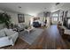 Spacious living room featuring vaulted ceilings, stylish furnishings, and an open layout at 6601 Thackston Dr, Riverview, FL 33578