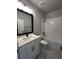 Modern bathroom featuring a marble-look floor, white subway tile in the shower and black fixtures at 7225 Sutton Ln, Sarasota, FL 34240