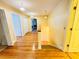 Charming upstairs hallway showcasing gleaming hardwood floors and an abundance of natural light at 7705 W Four Pines Rd, Plant City, FL 33565