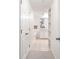 Bright bathroom with white cabinetry, tiled floors, and a large mirror at 1910 E Palm Ave # 10301, Tampa, FL 33605