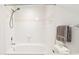 Clean and functional bathroom featuring a tub and shower with white tiled walls at 1910 E Palm Ave # 10301, Tampa, FL 33605