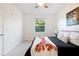 Inviting bedroom with natural light, contemporary decor, and a comfortable bed at 1910 E Palm Ave # 10301, Tampa, FL 33605