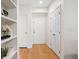 Hallway with hardwood floors, built in shelving, and access to bedroom at 1910 E Palm Ave # 10301, Tampa, FL 33605