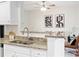 Open kitchen featuring modern granite countertops and stainless steel sink and faucet at 1910 E Palm Ave # 10301, Tampa, FL 33605