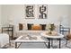 Stylish living room featuring neutral tones, modern art, and ample natural light at 1910 E Palm Ave # 10301, Tampa, FL 33605