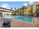 Spacious swimming pool with lounge chairs, offering a resort-style living experience with a modern aesthetic at 1910 E Palm Ave # 10301, Tampa, FL 33605